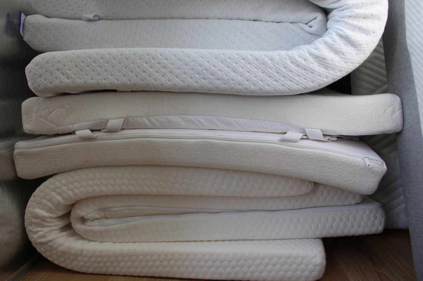 multiple stacked mattress toppers